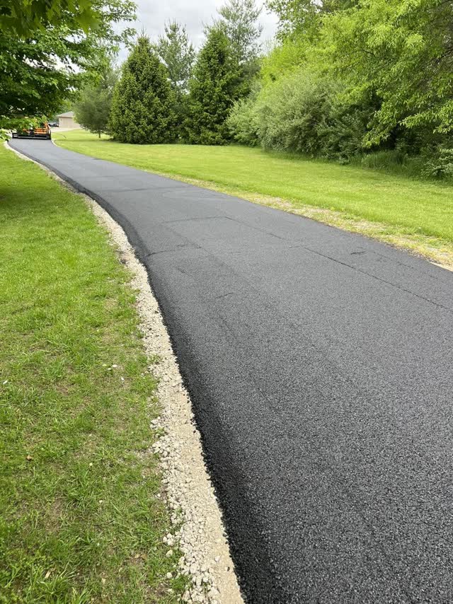Fresh asphalt mat on a long private lane