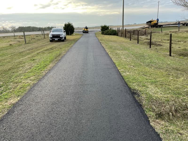 Long resurfaced rural driveway with the roller finishing at the far end